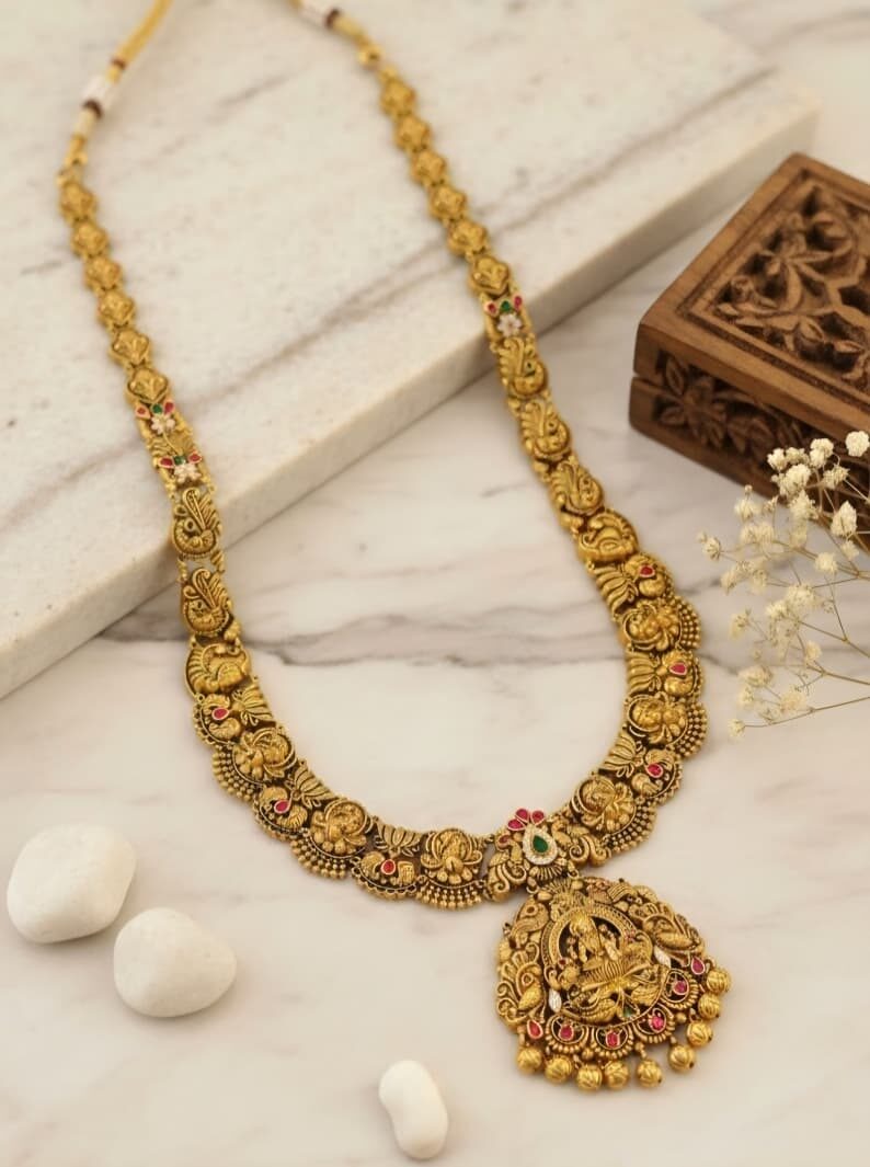 Antique gold haram with stone-set Lakshmi pendant