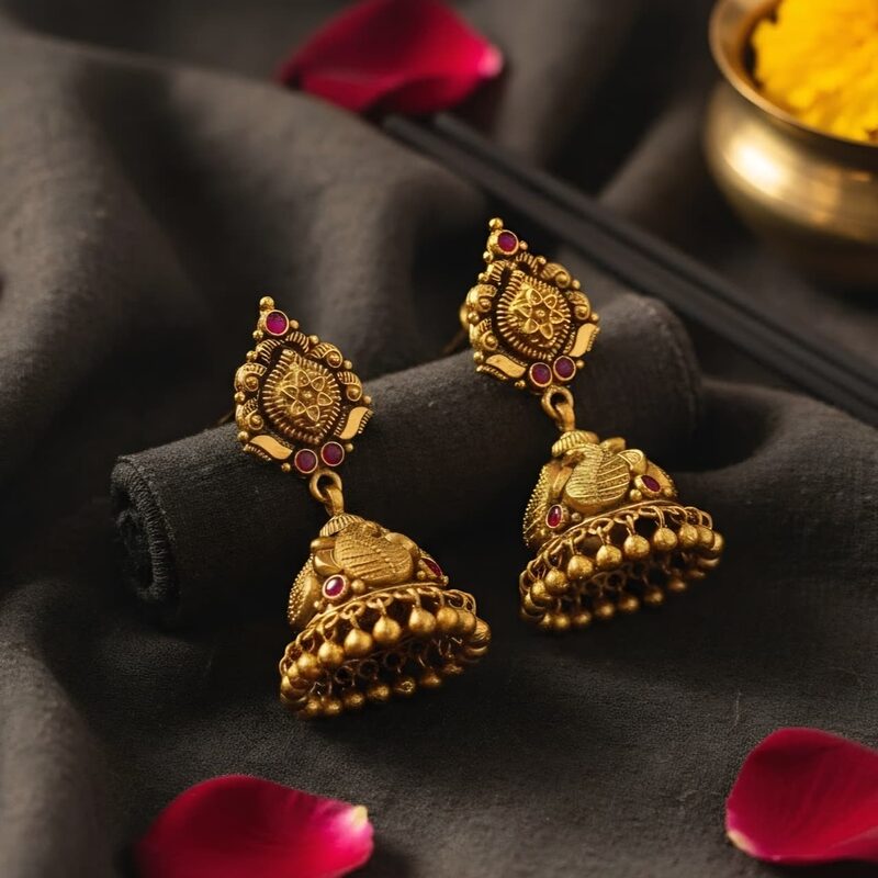 Antique gold Lakshmi jhumka earrings with kemp stones