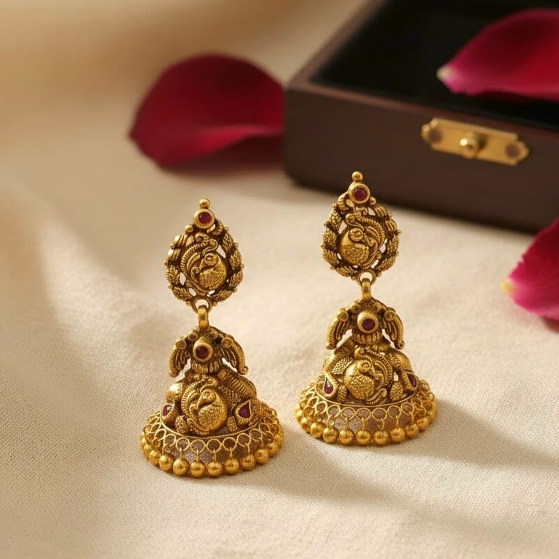 Antique gold Lakshmi and peacock jhumka earrings