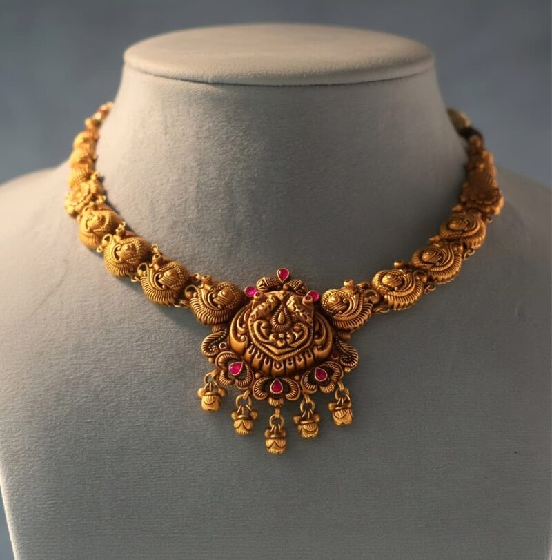 Antique gold nakshi choker with kemp stones and bead drops