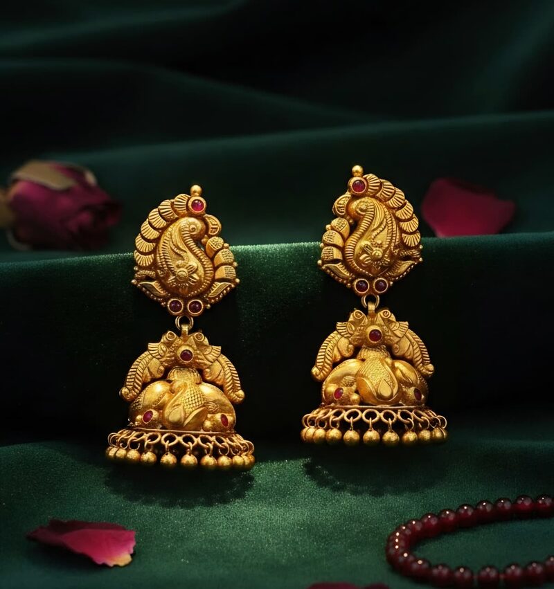 Antique gold peacock jhumka earrings with red kemp stones