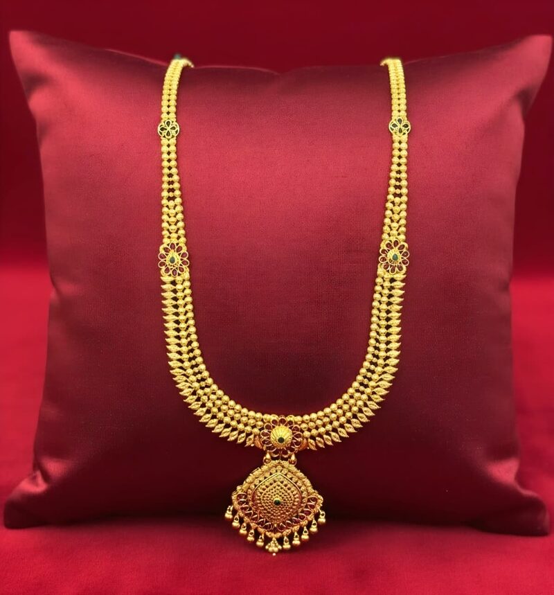 Slim gold beaded necklace with a small pendant drop