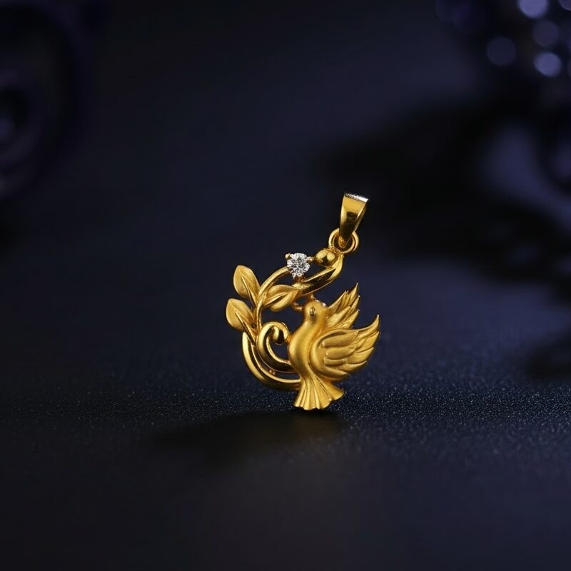 Gold bird pendant with CZ accent and leaf plume