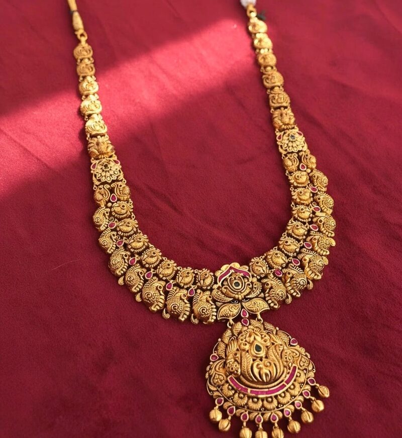 Gold bridal haram with peacock temple pendant and fringe