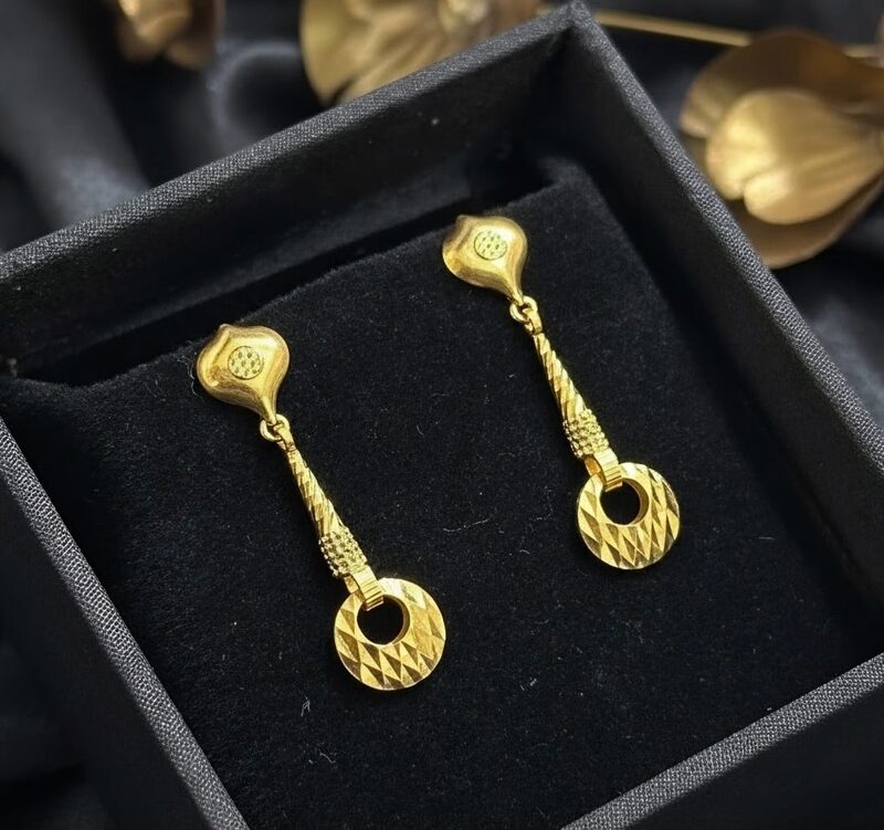Gold drop earrings with diamond-cut circular disc