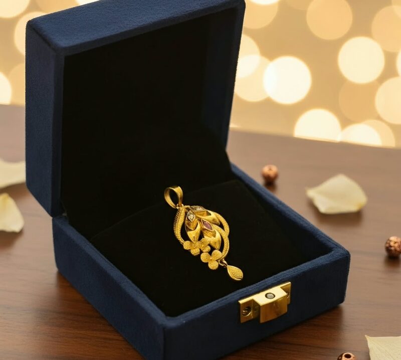 Gold floral pendant with hanging drop