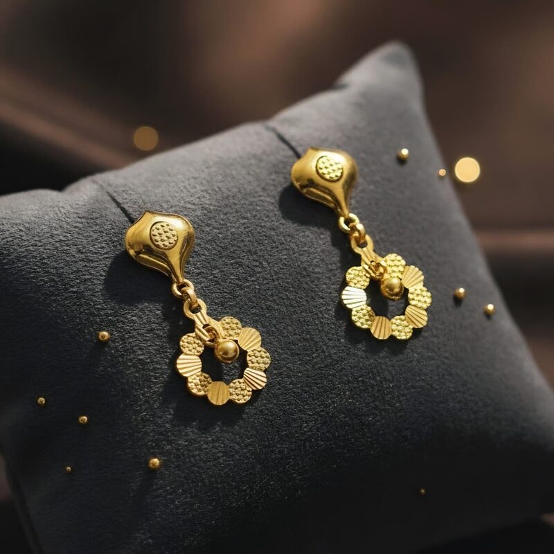 Gold drop earrings with floral ring and bead centre