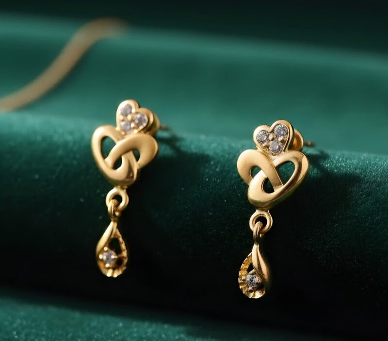 Gold heart-knot earrings with CZ drops