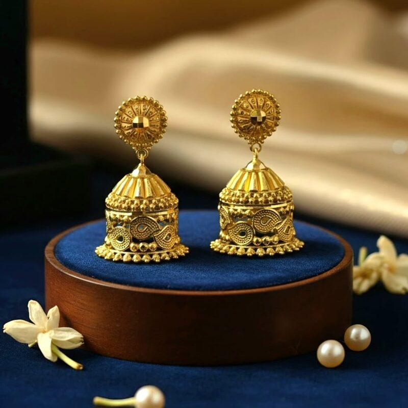 Gold jhumka earrings with meenakari enamel work and bead fringe