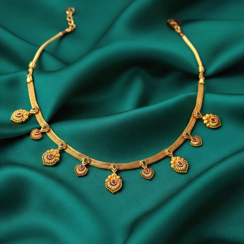 Flat gold kodi necklace with paisley and stone drops