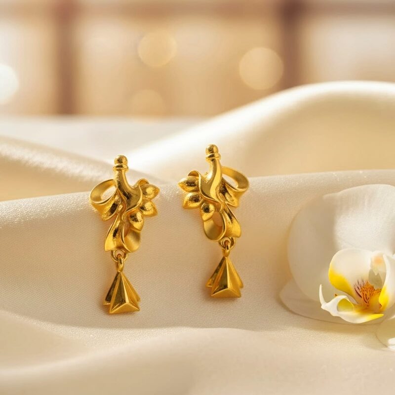 Gold drop earrings with sculpted leaf design