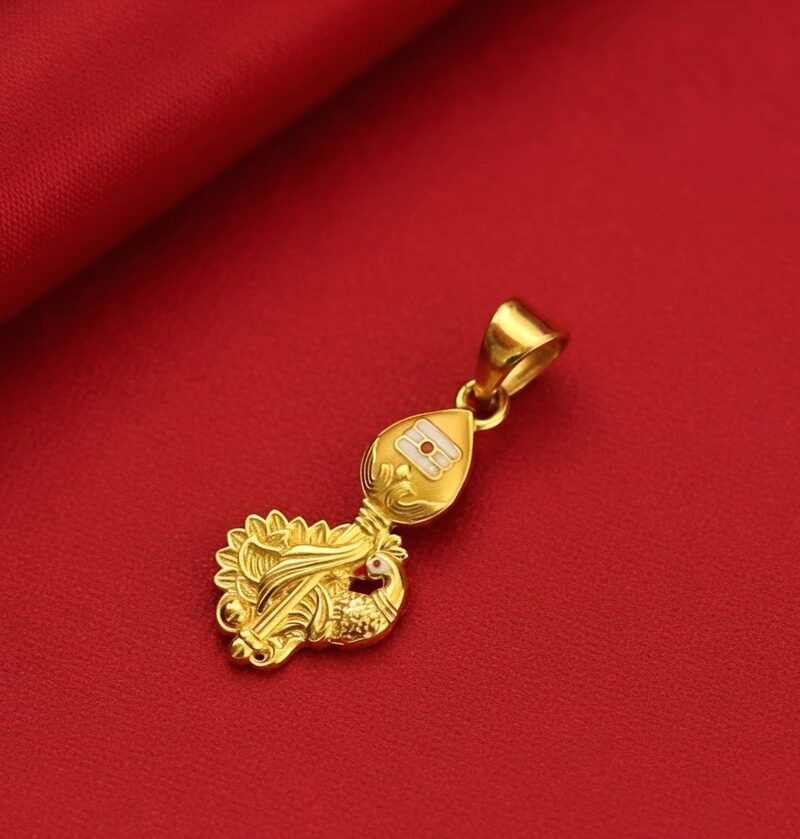 Gold paisley pendant with enamel detail