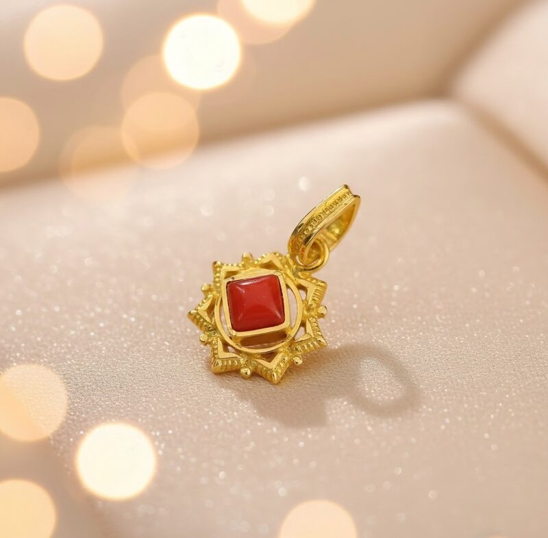 Gold star pendant with square red stone