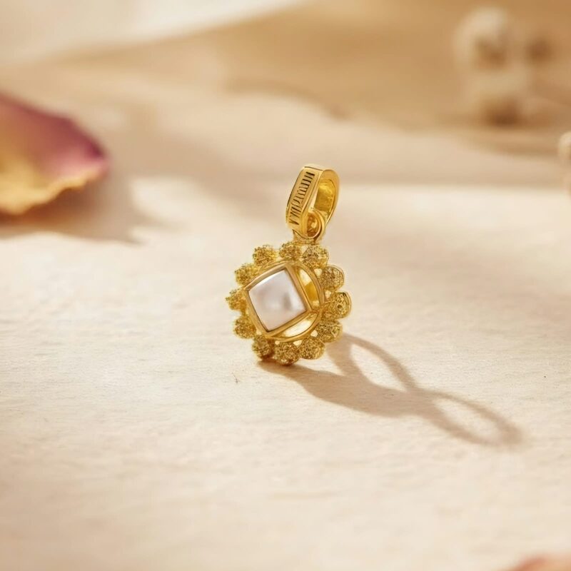 Gold pendant with square white stone in beaded frame