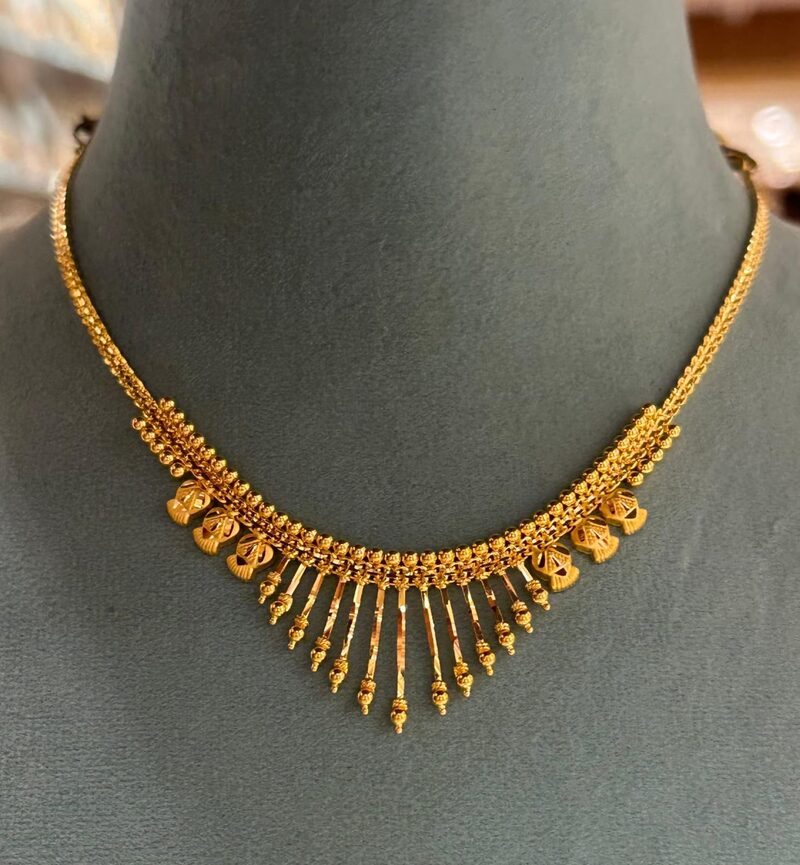 Gold collar necklace with graduated tassel fringe