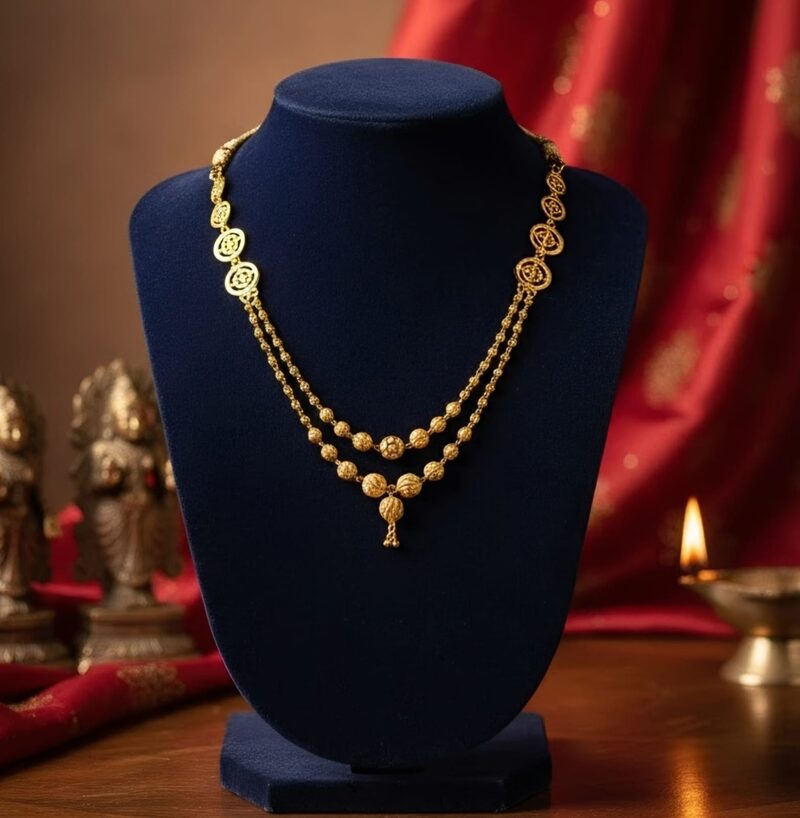 Two-strand gold bead necklace with small drop