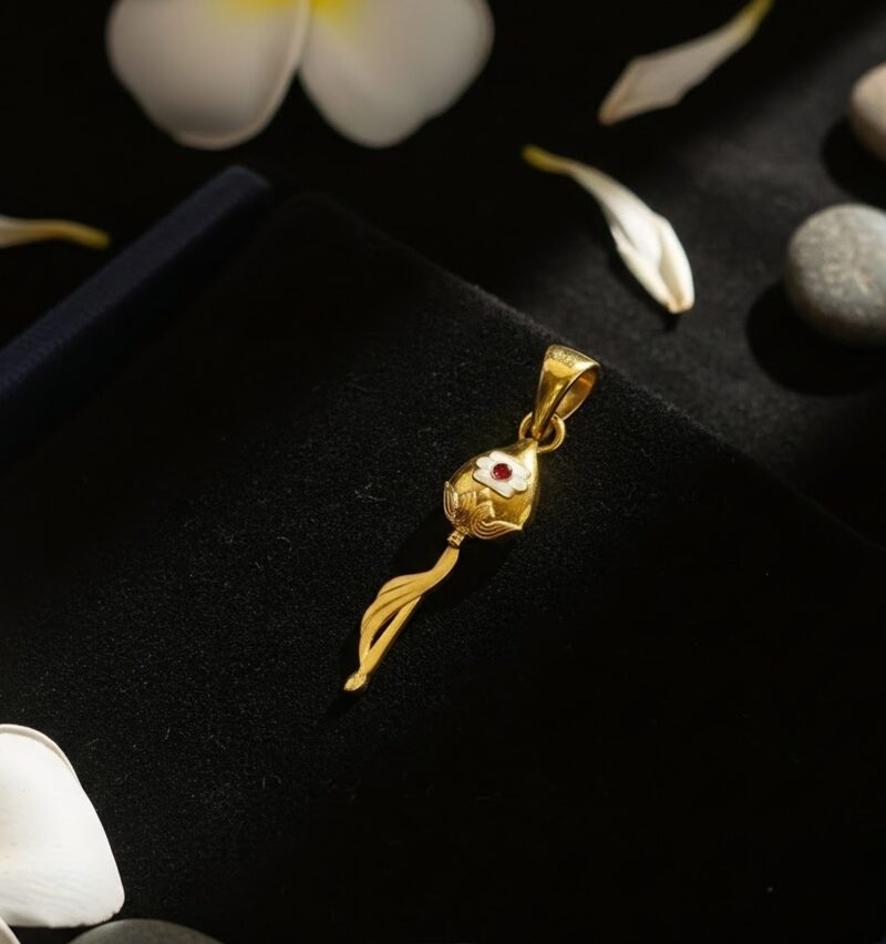 Gold vine pendant with ruby accent